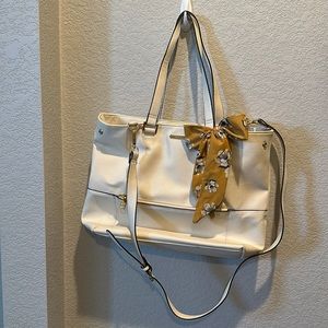 White Steve Madden purse with yellow, floral bow